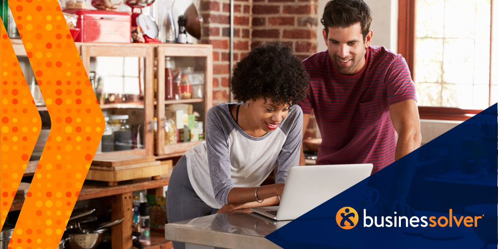 couple-looking-at-computer-smiling-businessolver-branded-image